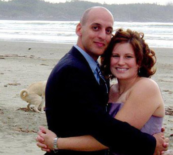 dog photobomb cuddling couple on beach