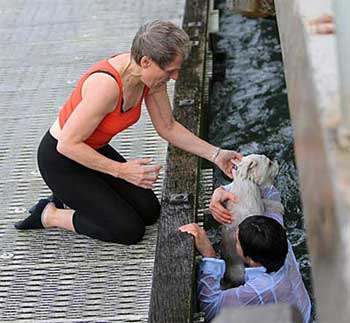 man rescues dog from water