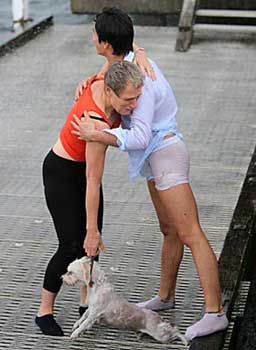 man hugs dog owner after dog rescue